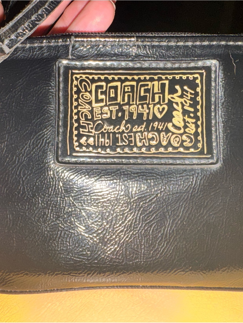 Coach Black Leather Wristlet with Gold Logo Plaque